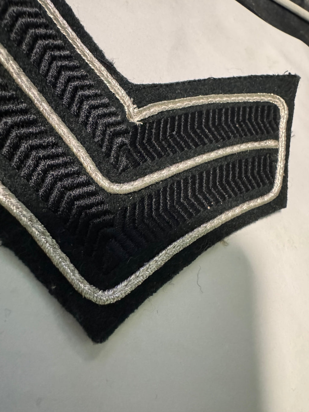 The Rifles Corporal Rank Chevrons – Silver on Black/Green